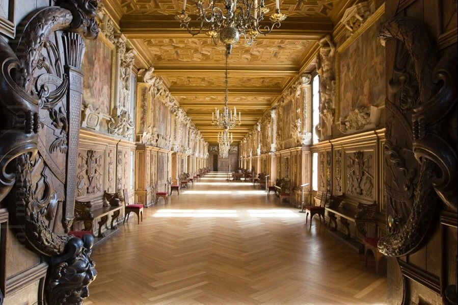 Image of a wooden herringbone pattern flooring at Chateau de Fontainbleau.